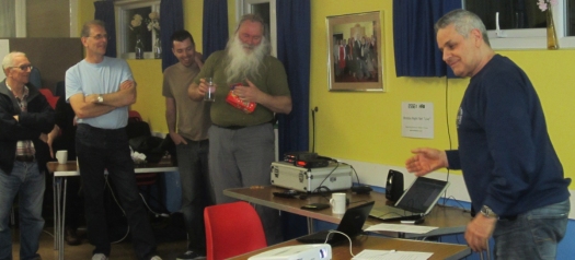 Clive G1EUC, lobbing the Easter Egg quiz prize to Peter G0DZB