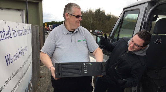James 2E1GUA, holding a DMR repeater