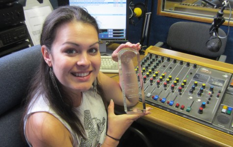 FrequencyCast presenter Kelly, showing off her award